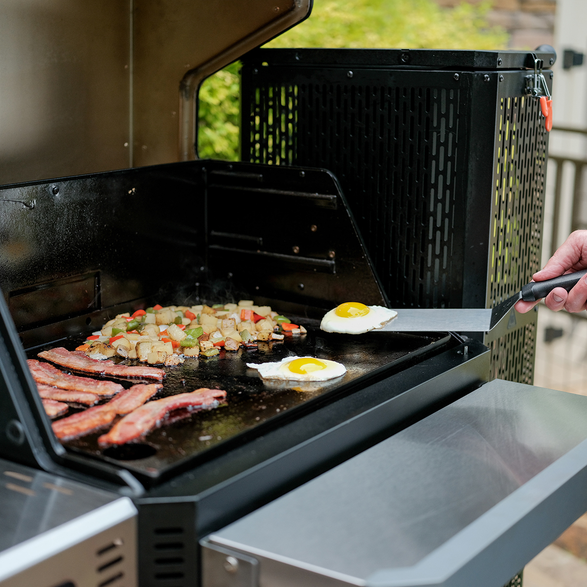 Includes interchangeable flat top griddle insert and cast-iron grill grates.